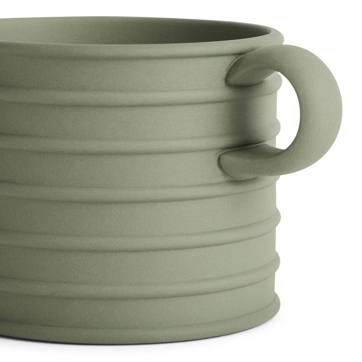 JW Anderson Mug Pair Marsh Green / Sage Green - A close-up of a ribbed ceramic mug in a muted sage green color, featuring a matching handle and a clean white background.